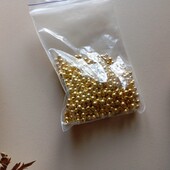 Намистини золотисті