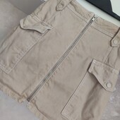 Бежева міні спідниця з накладними кішенями р.36 евро